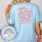 Light blue t-shirt with 'ADMIN TEAM' design on the back, worn by a person.