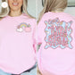 Pink sweatshirt with 'Third Grade' design on the back, featuring a rainbow, apple, and cloud.