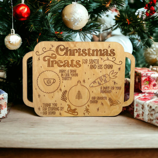 wooden laser engraved tray that says christmas treats and depicts a spot for santa's cookie, milk, and a spot for a carrot